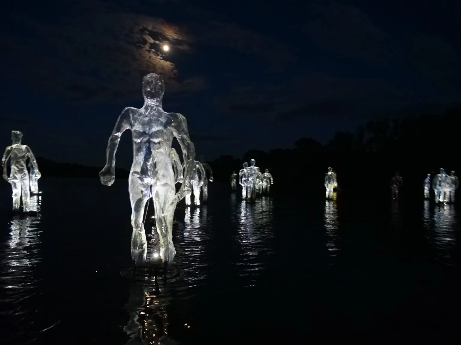 Enlighted floating humain shells by a deep night with the moon.