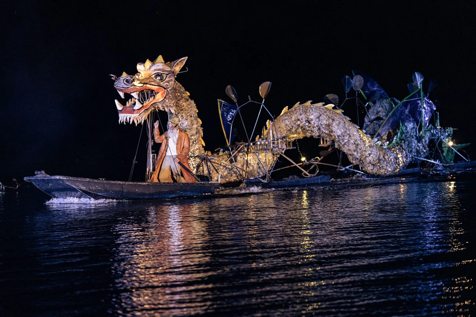 During the water show The Extraordinary Journey, a water dragon and its master, an image of the ilotopie theater on the water company