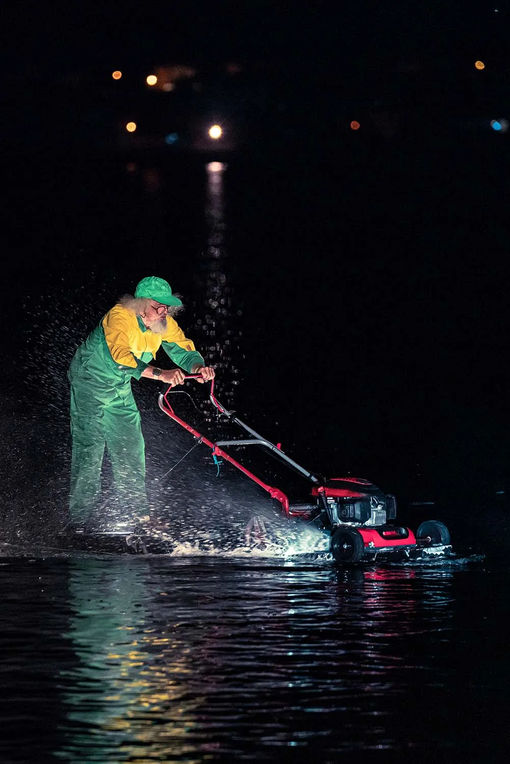 The water show The Extraordinary Journey by ilotopie à Fos-sur-Mer, France. A picture : A man with a mower on the water.