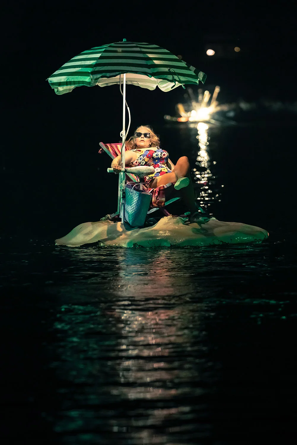 A touriste girl on her personal floating island. A picture from the water show the extraodinary journey by ilotopie company