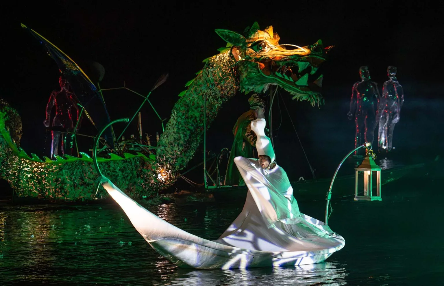 A dragon and a man on a petal on water. A Flash moment of the extraodinary Journey.