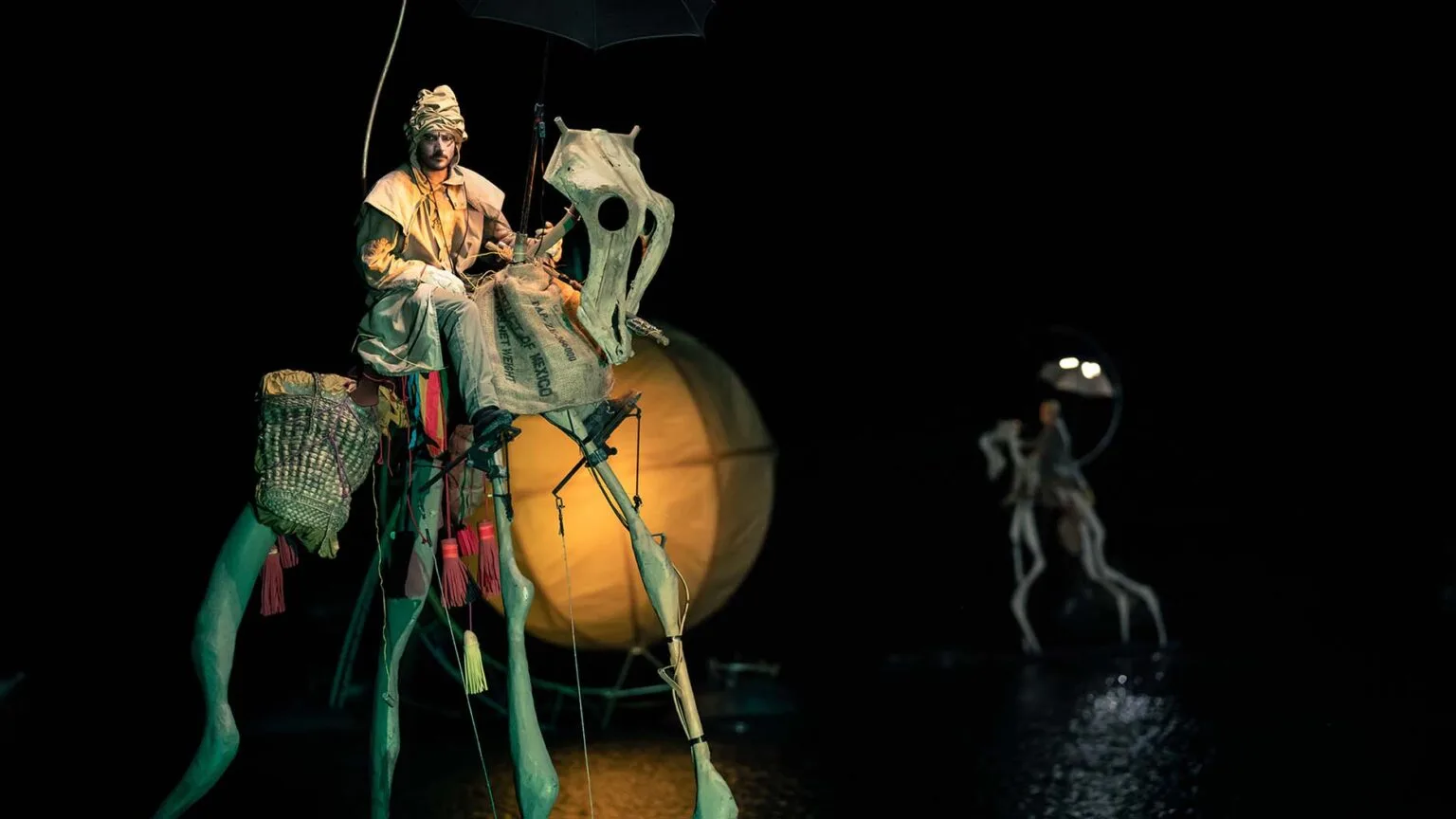 water show the extraodinary Journey, a rider and his very high, made of bones floating horse.