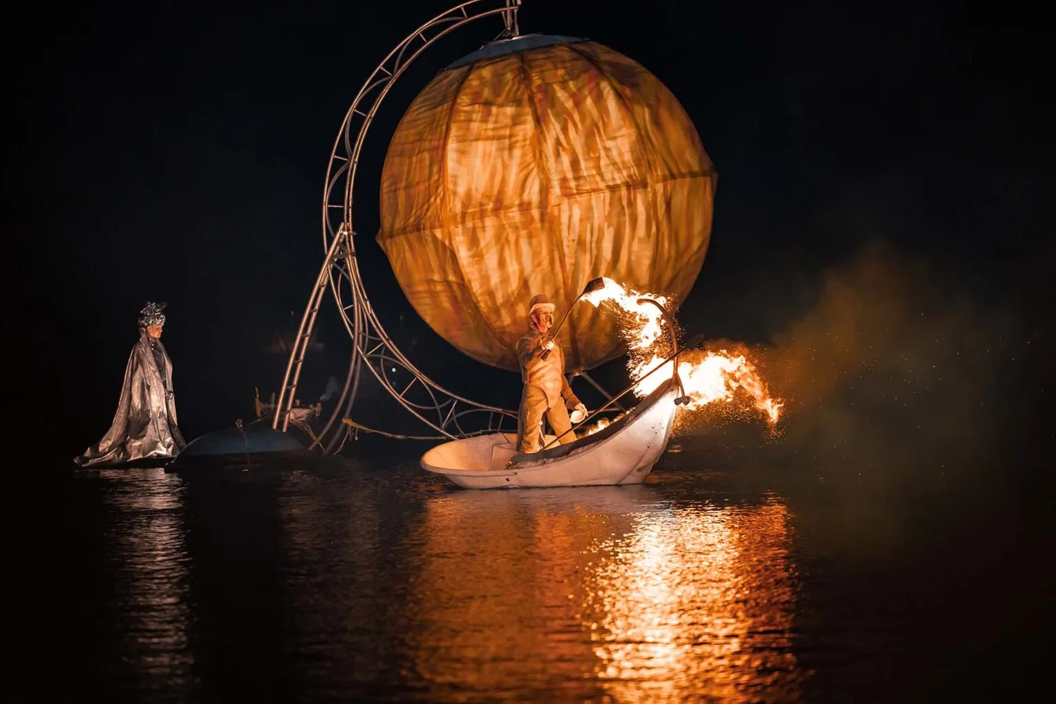 A heck on the water with fire and silver character walking on the water looking at him.